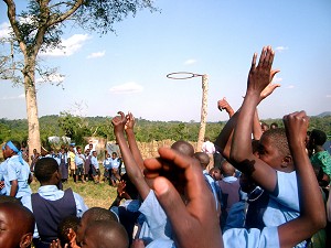 Spectators cheer during a game of netball